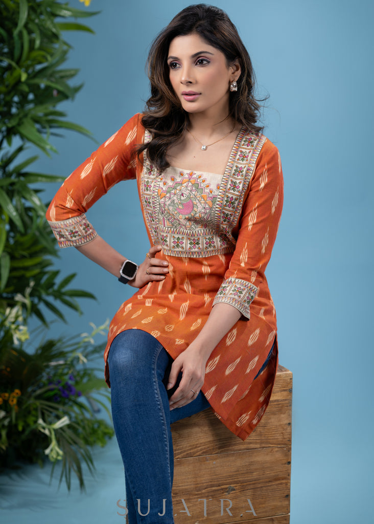 Graceful orange cotton ikat tunic with madhubani combination