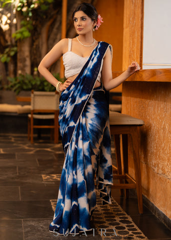 Stylish Navy Blue Shibori Georgette Saree With Beautiful Overall Sequenced Crochet Highlighted With Minimal Pearl Lace