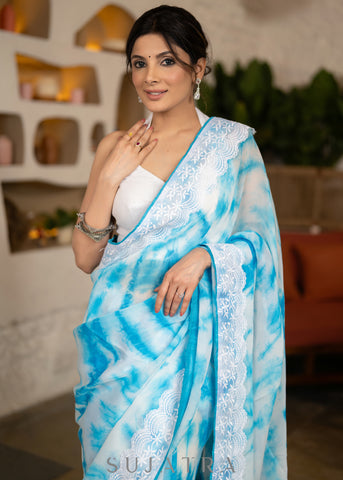 Beautiful Sky Blue Tie & Dye Organza Saree Highlighted With Matching Crochet Lace