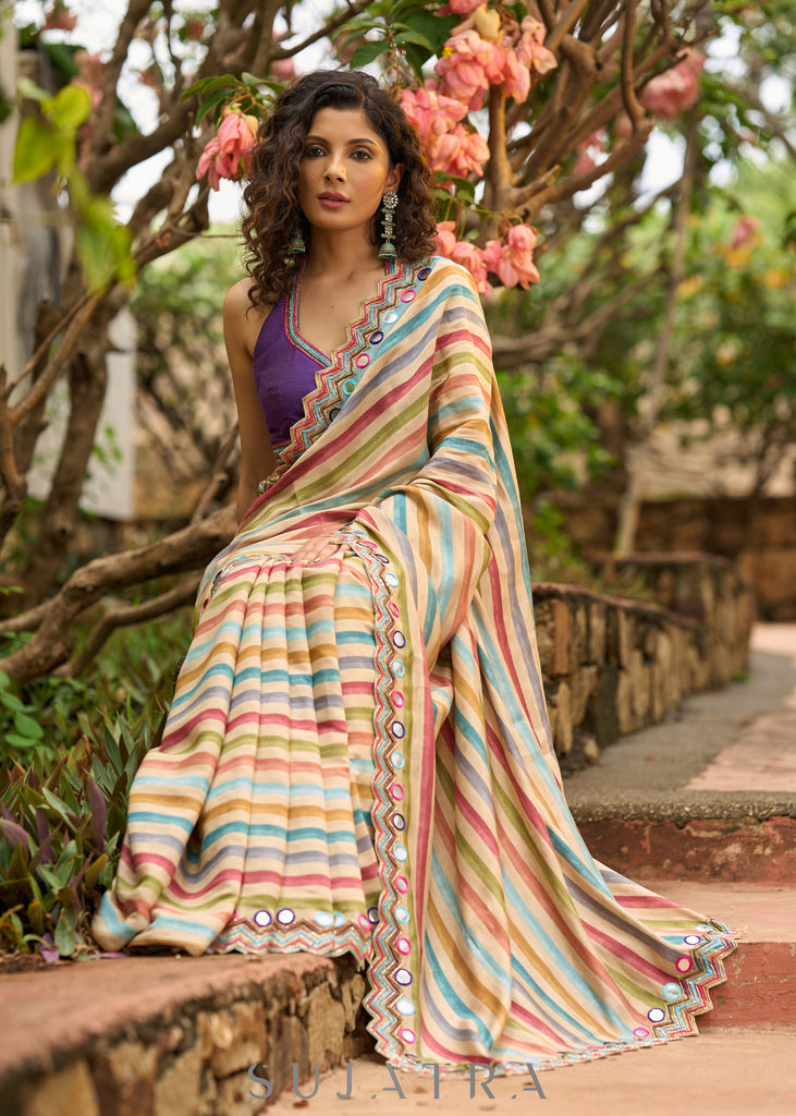 Stunning multicolor striped printed saree highlighted with elegant bold mirror work embroidery