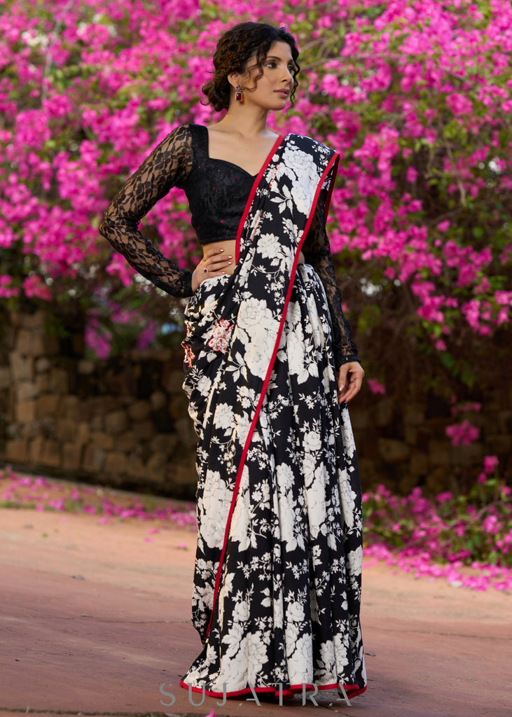 Trendy black floral printed cotton saree highlighted with overall bead embroidery