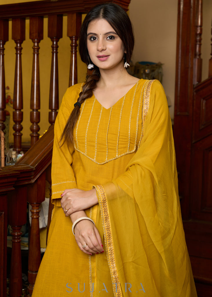 Graceful delicate mustard cotton kurta with a lace yoke and matching pants - Dupatta Optional