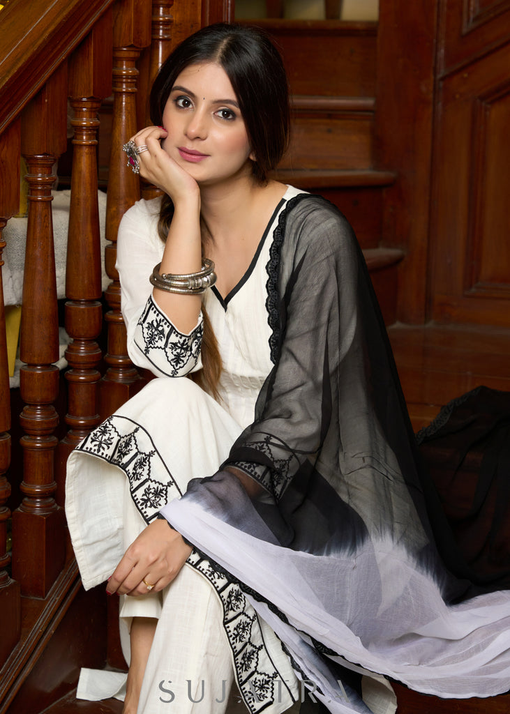 Elegant off-white cotton kurta adorned with intricate embroidery complimeted by matching pants - Dupatta Optional