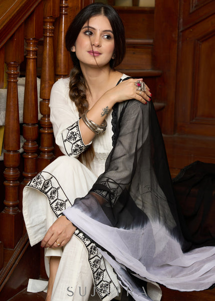 Elegant off-white cotton kurta adorned with intricate embroidery complimeted by matching pants - Dupatta Optional