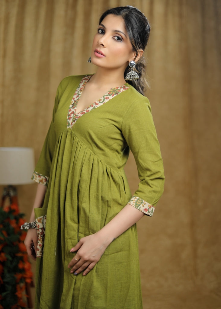 ON-SALE-breezy-mehendi-green-cotton-kurti-with-floral-print-detaling-pocket