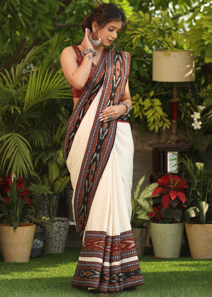 Elegant off-white Cotton saree with beautiful Ikat double border