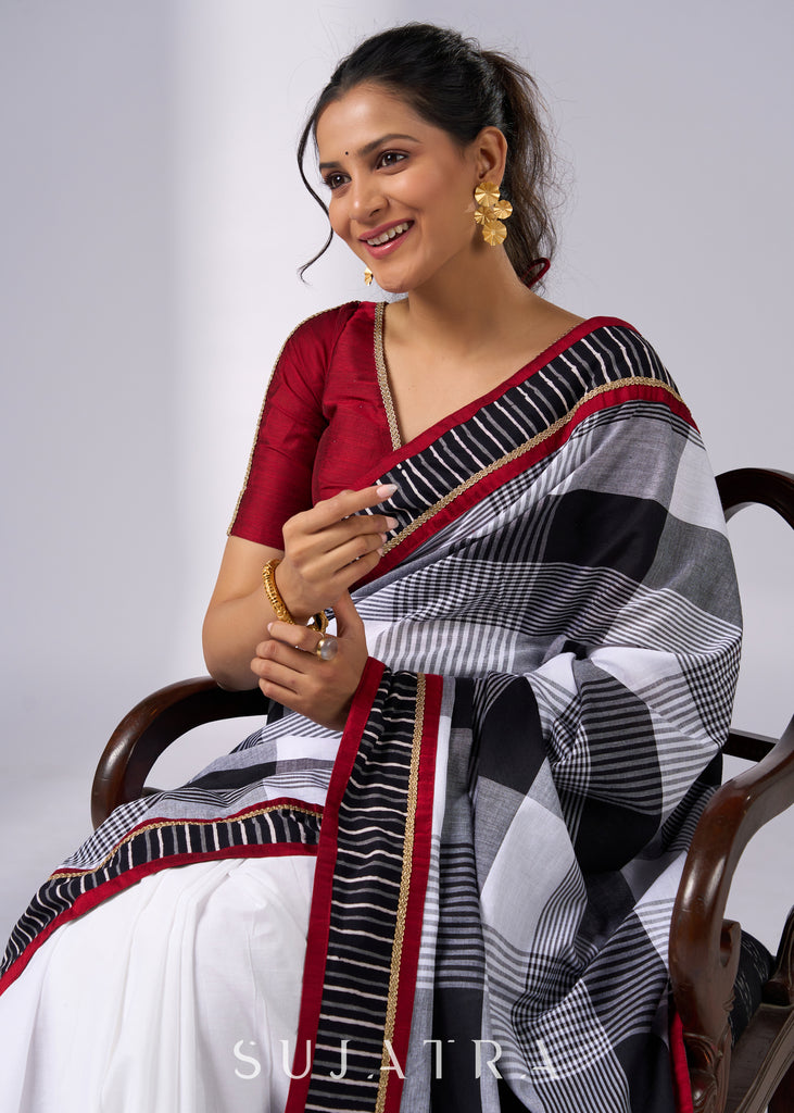 Classy white cotton saree with bold checks & red-black borders