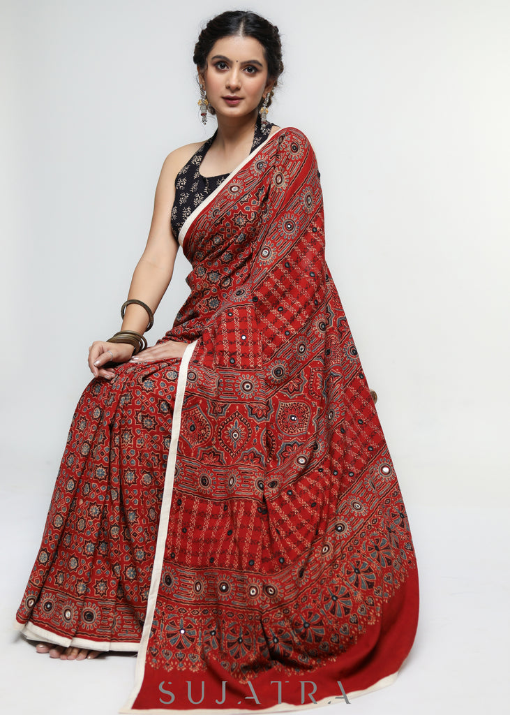 Stunning Red Ajrakh Saree with Mirrorwork detailing & White Border