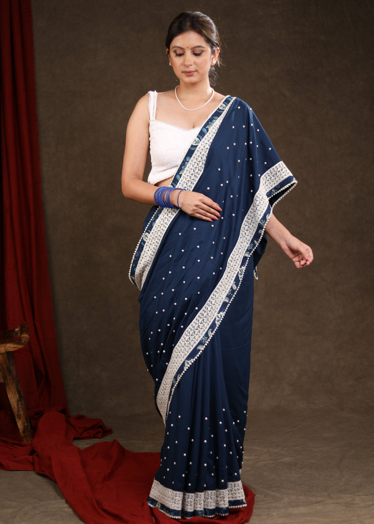 Elegant Ocean Blue Rayon Saree Highlighted with Moti Work & Beautiful Lace Detailing