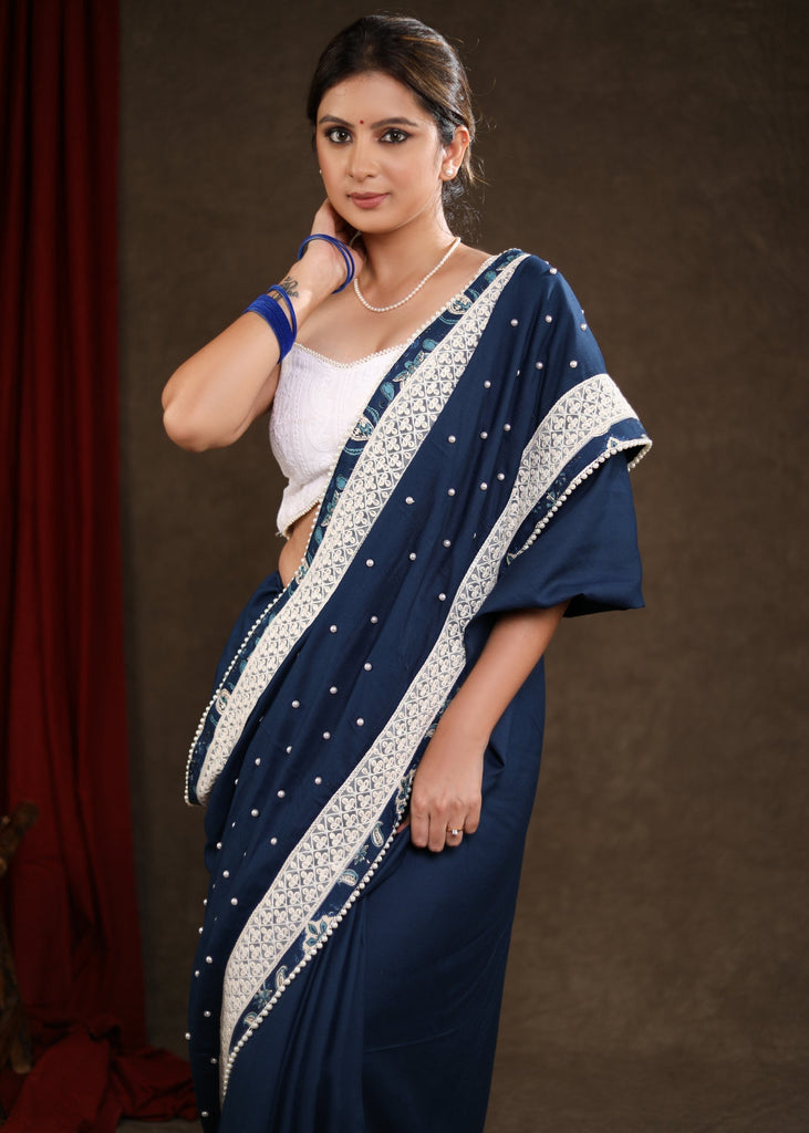 Elegant Ocean Blue Rayon Saree Highlighted with Moti Work & Beautiful Lace Detailing