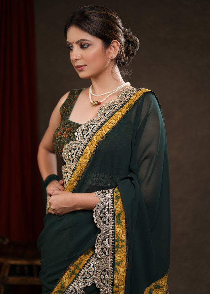 Stylish Emerald Green Georgette & Ajrakh Combination Saree Highlighted with Beautiful Lace