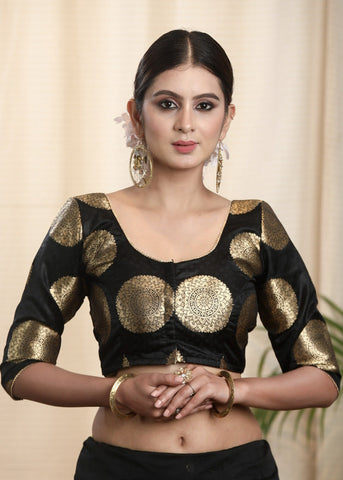 Pure Banarasi Blouse in Black and Gold with Lace on neckline and sleeves . Lining Given