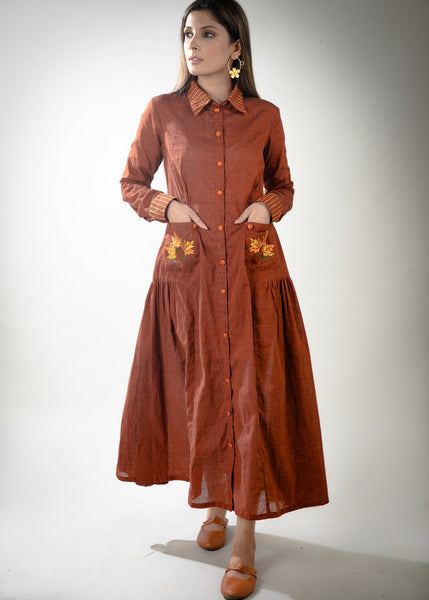 Rust cotton dress with embroidered pockets